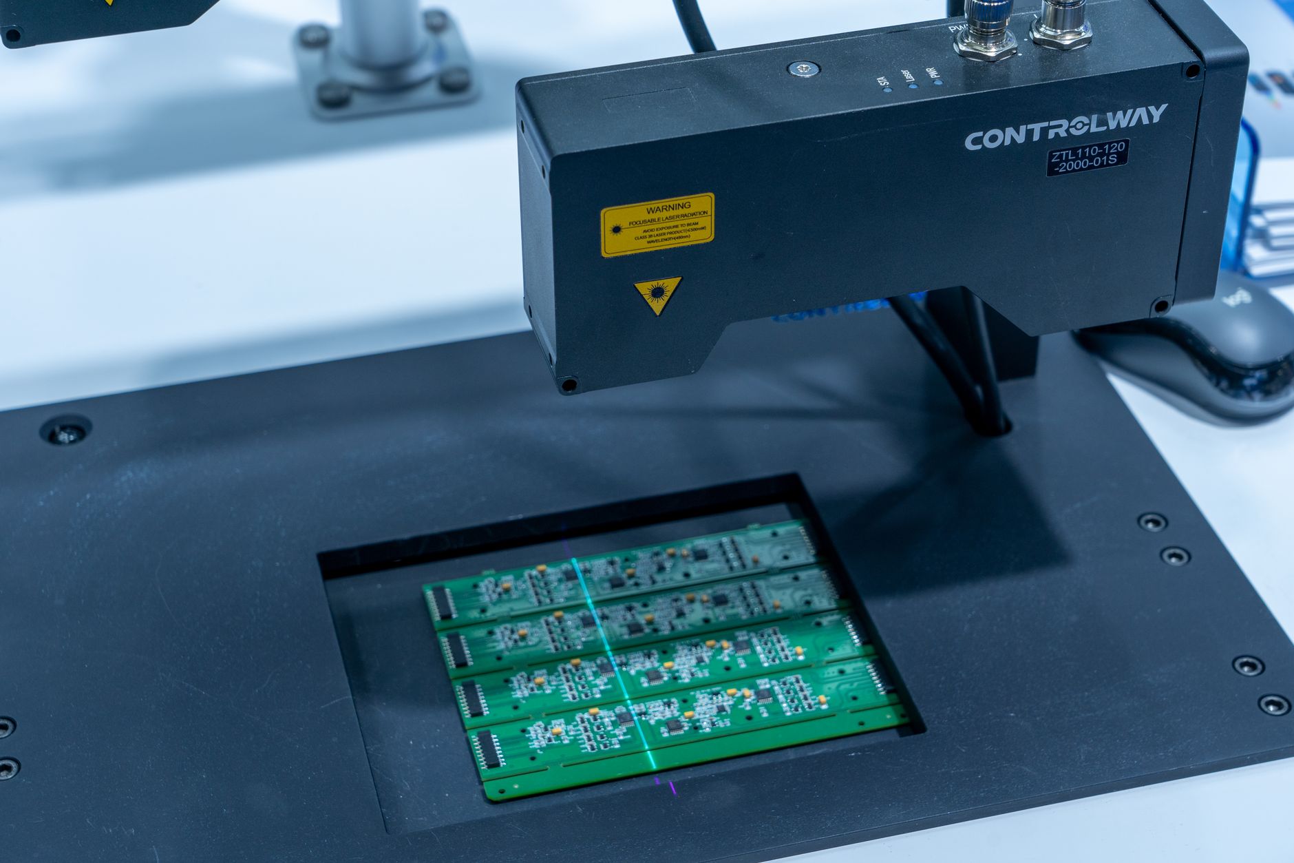 Close-up of a PCB inspection machine in action, highlighting technology.